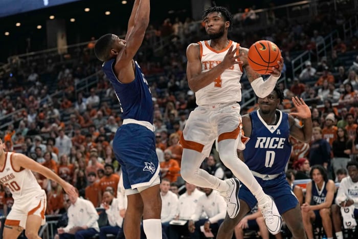 Texas Longhorns guard Tyrese Hunter (4) passes the ball around Rice Owls guard Travis Evee (3) during the first half at Moody Center.